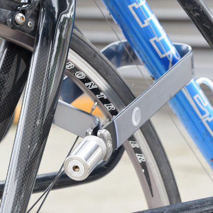 TiGr BLUE mini+ shown here locking front wheel and down tube of bike frame to a bike rack